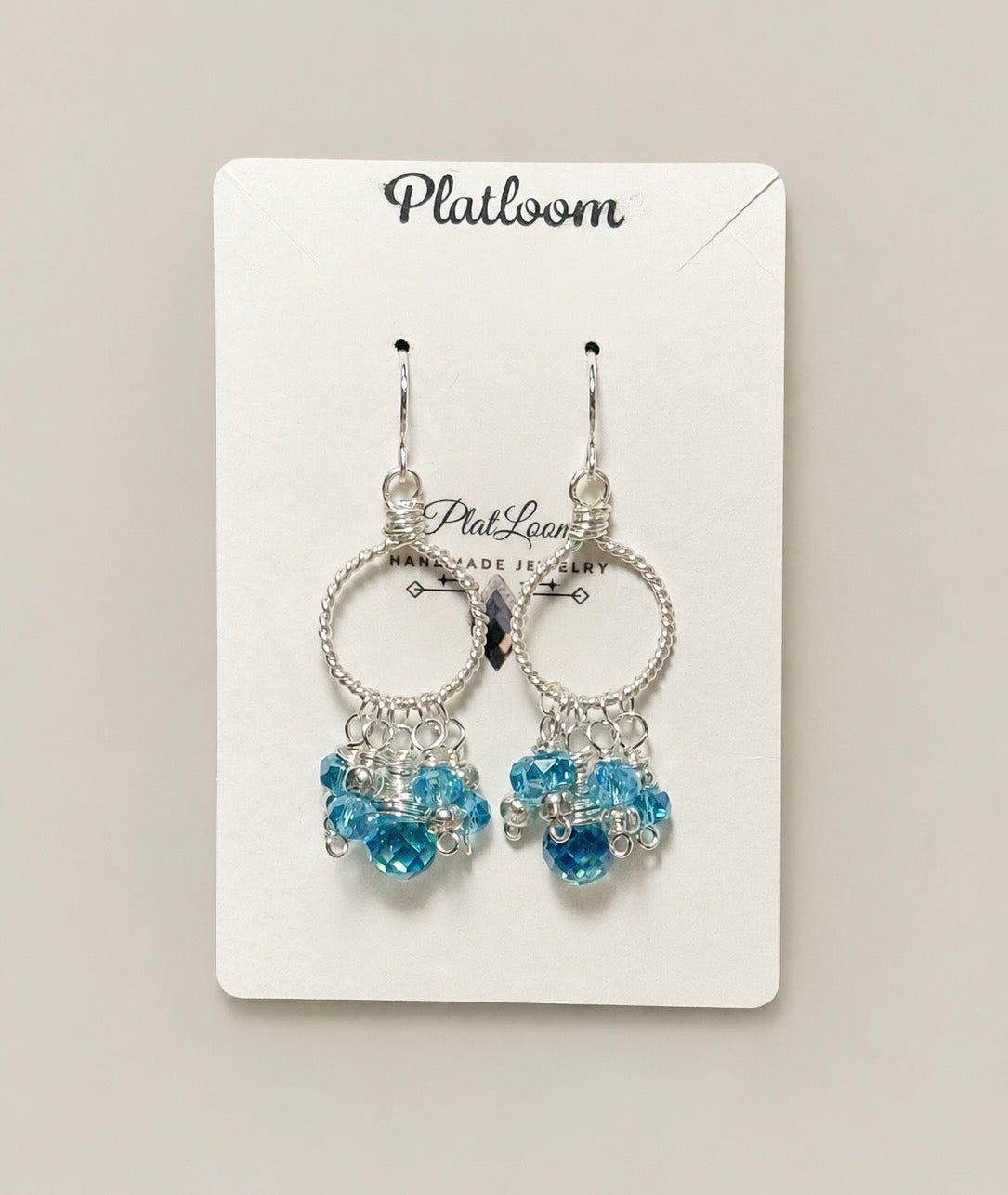 Icy Blue Topaz Cluster Hoop Earrings | Silver Rope
Dangle Jewelry