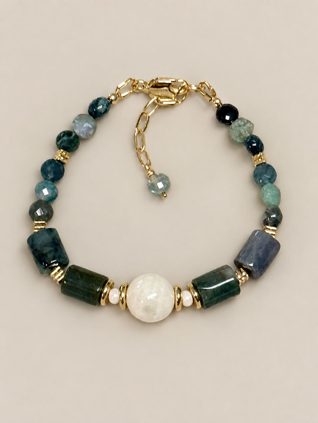 Natural fancy Jasper gemstone bracelet with faceted coin and tube beads, a milky jade focal bead, gold-plated spacers, and 14K gold-filled clasp and extender.